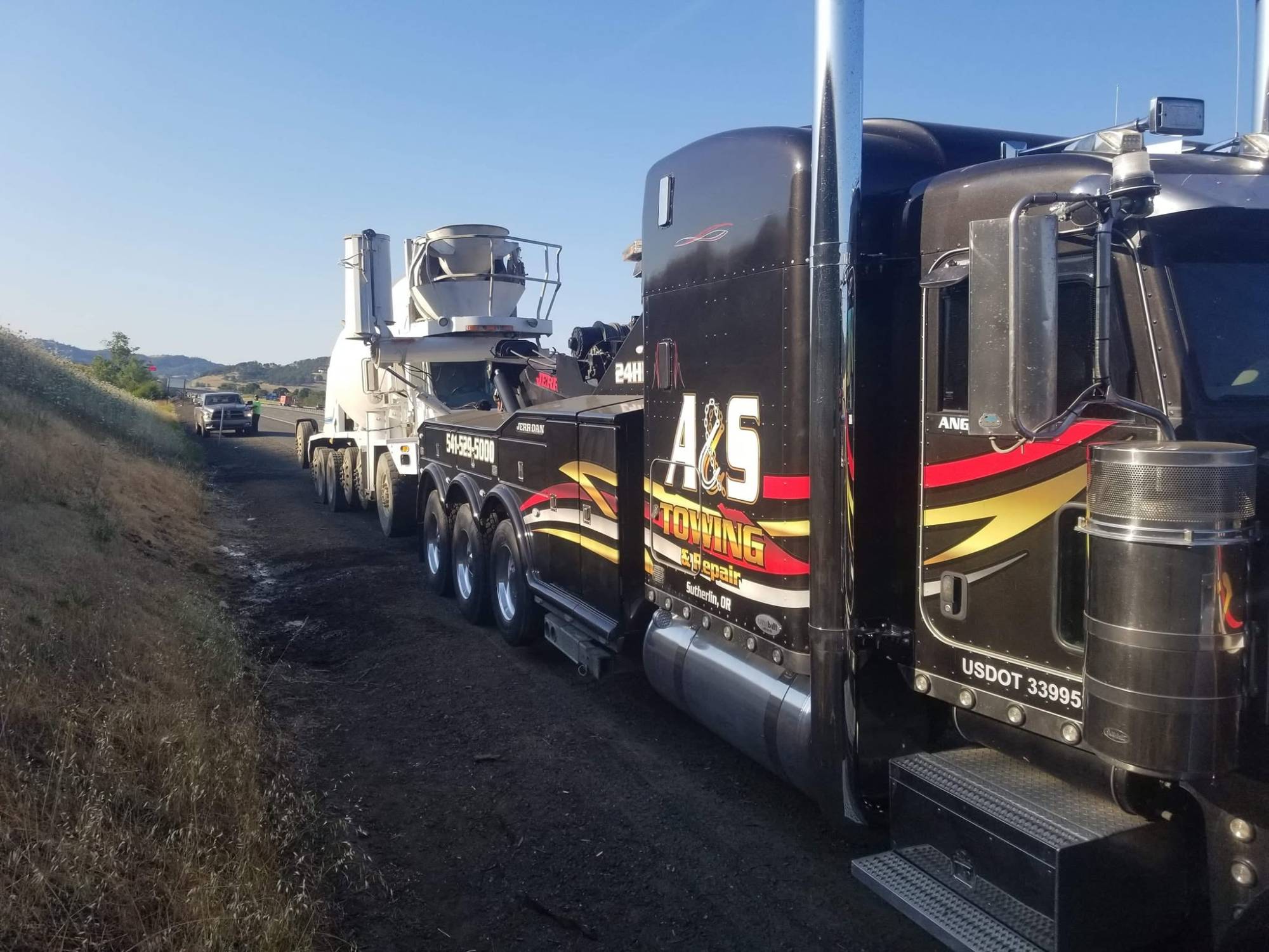 A&S heavy wrecker recovering a cement mixer on I-5