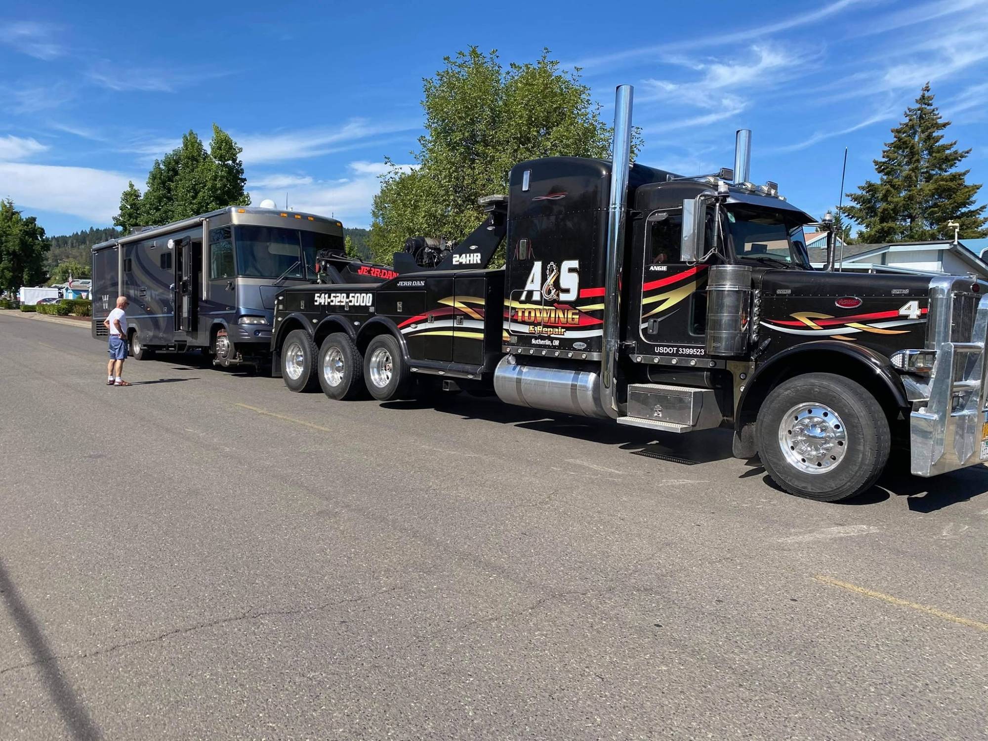 A&S Peterbilt heavy wrecker towing a large motorhome